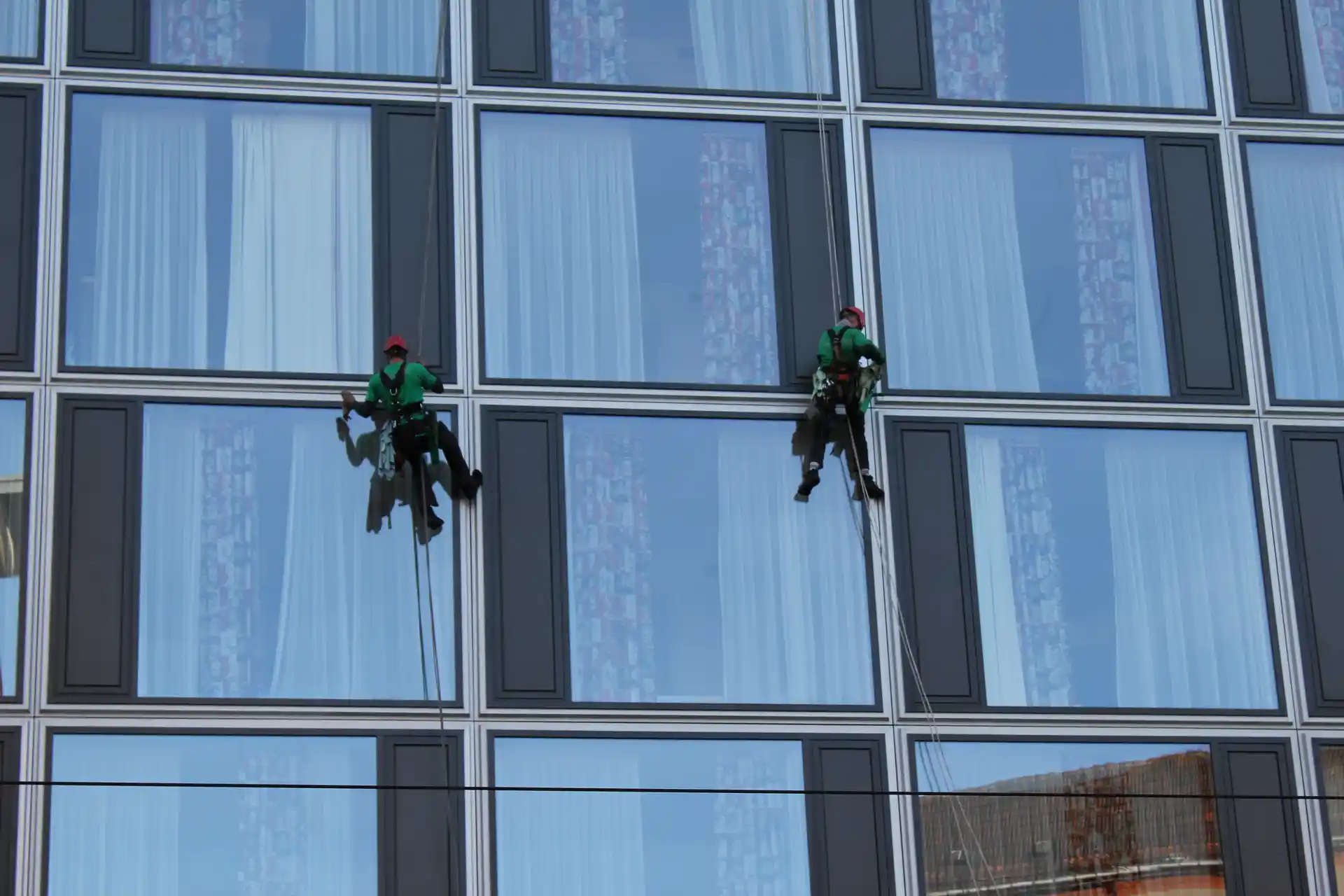 Commercial cleaning company Dubai — Spring Blue team cleaning a Dubai office tower